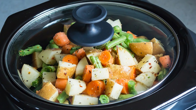diced vegetables in a slow cooker